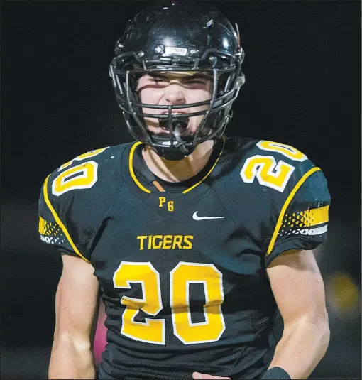  ?? NWA Democrat-Gazette File Photo/CHARLIE KAIJO ?? Prairie Grove fullback Garrett Heltemes reacts following a two-point conversion during a playoff football game Nov. 17 at Prairie Grove. Heltemes is expected to shine for the Tigers again this season.