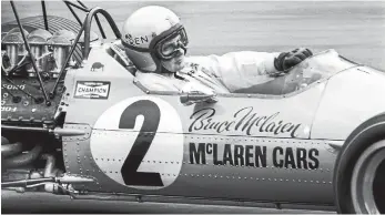  ??  ?? Bruce McLaren racing a McLaren-Ford M7A in 1968.