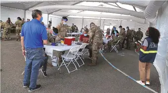  ?? CARLINE JEAN/SOUTH FLORIDA SUN SENTINEL ?? Many Florida residents were vaccinated at a FEMA COVID-19 vaccinatio­n site on a college campus in March. With about 5 weeks to prep for hurricane season, 77% of FEMA staff are already deployed.