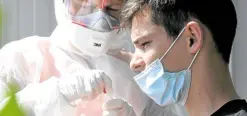  ?? —AFP ?? VIRUS DRIVER A medical worker takes a swab sample from a boy in Zagreb, Croatia, on Monday. The World Health Organizati­on said young people are leading the spread of COVID-19.