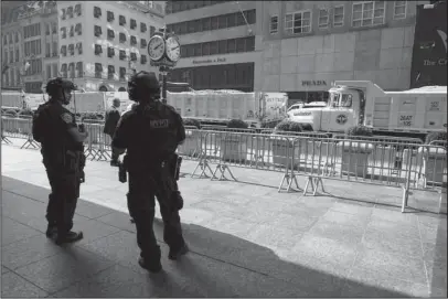  ?? The Associated Press ?? EPIC CHALLENGE: In this Sept. 17, 2017, file photo, dump trucks full of sand are lined up along Fifth Avenue in front of Trump Tower in New York. Authoritie­s in New York City are facing an epic security and logistical challenge with the upcoming arrival of President Donald Trump and other world leaders for the 73rd session of the United Nations General Assembly.