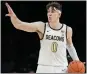  ?? JOHN MINCHILLO — AP ?? The Grizzlies drafted Wake Forest's Jake LaRavia with the 19th pick Thursday.
