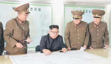  ??  ?? Kim visits the Command of the Strategic Force of the Korean People’s Army (KPA) in an unknown location in North Korea in this undated photo released by North Korea’s Korean Central News Agency (KCNA). — Reuters photo