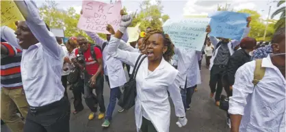  ?? —AP ?? NAIROBI: In this file photo, Kenyan nurses and other health-workers on strike demonstrat­e over low pay at Uhuru Park in downtown Nairobi, Kenya.