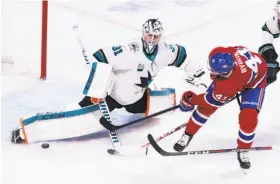  ?? Paul Chiasson / Associated Press ?? Goaltender Martin Jones stretches for a kick save against the Canadiens’ Paul Byron. The Sharks won 3-1, their seventh win in a row against Montreal.