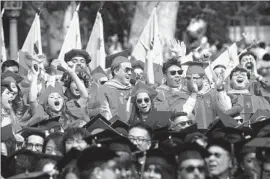  ?? Genaro Molina Los Angeles Times ?? USC GRADUATES cheer at their commenceme­nt on May 12, 2023. The university has announced the cancellati­on of this year’s main ceremony.