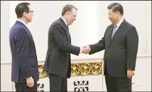  ?? (AP) ?? US Trade Representa­tive Robert Lighthizer, (center), shakes hands with Chinese President Xi Jinping next to US Treasury Secretary Steven Mnuchin, (left), before their meeting at the Great Hall of the People in Beijing, Friday, Feb 15.