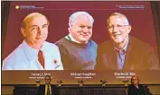  ?? Jonathan Nackstrand AFP/ Getty I mages ?? NOBEL COMMITTEE members in Stockholm discuss the three scientists awarded the prize in medicine for their discovery of the hepatitis C virus.