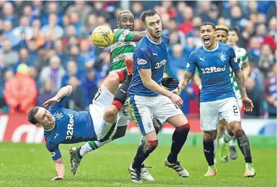  ?? Picture: SNS Group ?? Celtic striker Moussa Dembele is crowded out by Lee Hodson and Danny Wilson in the 1-1 draw at Celtic Park.