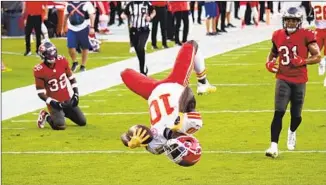  ?? Doug Murray Associated Press ?? TYREEK HILL did a backflip after one of his three scores when the Chiefs beat the Buccaneers in November. Tom Brady didn’t do well under pressure that day, which the Chiefs hope happens again.