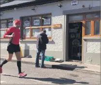  ??  ?? Kieran Walsh running past the Cork Penny Dinners building.