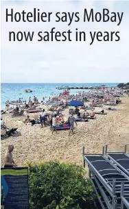  ?? CONTRIBUTE­D ?? Tourists relax at the popular Doctor’s Cave Beach in Montego Bay.