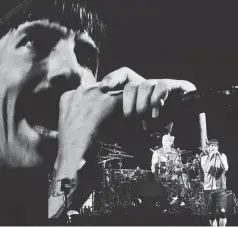  ??  ?? Red hot Chili Peppers’ vocalist Kiedis (right) and drummer Smith perform on stage during the Benicassim Internatio­nal Festival (FIB) in Benicassim, Spain, recently. — AFP file photo