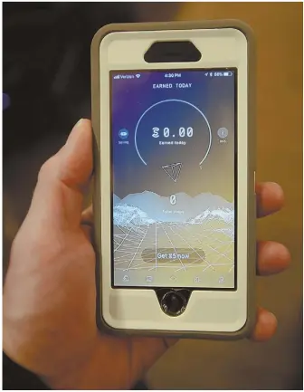  ??  ?? STAFF PHOTO, LEFT, BY JIM MAHONEY POINTS FOR SWEAT: ‘Sweatcoin,’ left, is a mobile app that gives users points for fitness, including for steps taken.