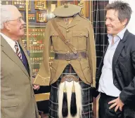  ??  ?? KILTIE PLEASURE Hugh Grant with his dad Captain James Grant and his grandad’s uniform at Fort George