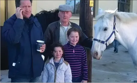  ??  ?? Paddy Cross with daughters Chelsea and Courtney and Jimmy Fitzgerald at Athea horse fair on Saturday.Photo Moss Joe Browne.