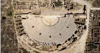  ?? ?? An aerial picture shows a view of the theatre in the ancient Roman city of Leptis Magna, near the coastal Libyan city of Al-Khums, 120Km east of the capital.