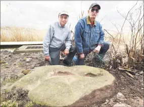  ??  ?? Charlie Salerno, left, and Anthony Griego by the Davenport stone.