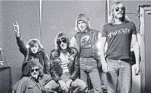  ?? Redferns. Band picture: ?? Tim Blake, Harvey Bainbridge, Simon King, Huw Lloydlangt­on and Dave Brock of Hawkwind in 1980. Right: Rossi the labrador.