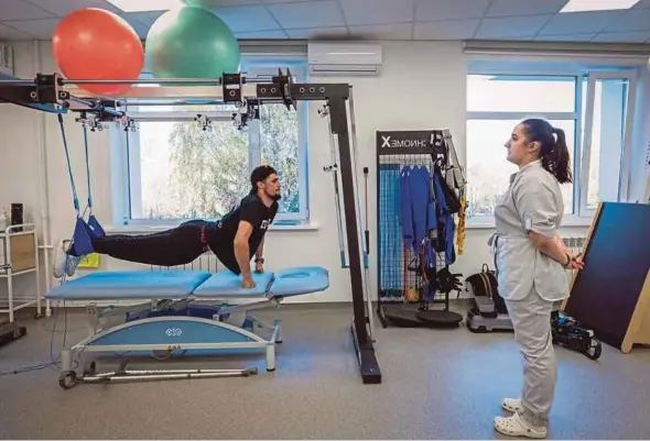  ?? ?? Rostyslav Prystupa exercising at the Recovery Rehabilita­tion Centre.