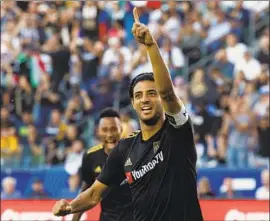  ?? Patrick T. Fallon For The Times ?? CARLOS VELA led the league in shots (160) and shots on goal (71), averaging a score every 80 minutes for the greatest offensive season in MLS’s 24-year history.