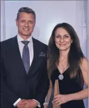  ??  ?? Presenting the Workforce and Workplace Relations Innovation award is Paul Cooper, CEO of Mining, Asia Pacific from award sponsor Sodexo, with Fortescue People group manager Linda O’Farrell.