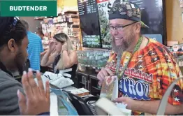  ?? TREVOR HUGHES/USA TODAY ?? “Budtender” Jason Coleman talks to a customer in the Medicine Man cannabis dispensary in Denver last year.