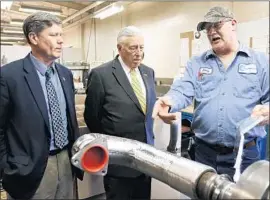  ?? Dan Reiland Eau Claire Leader-Telegram ?? HOUSE MINORITY Whip Steny H. Hoyer, center, and Rep. Ron Kind, left, visit a business in Wisconsin. Hoyer, at 78, still aspires to become House speaker.