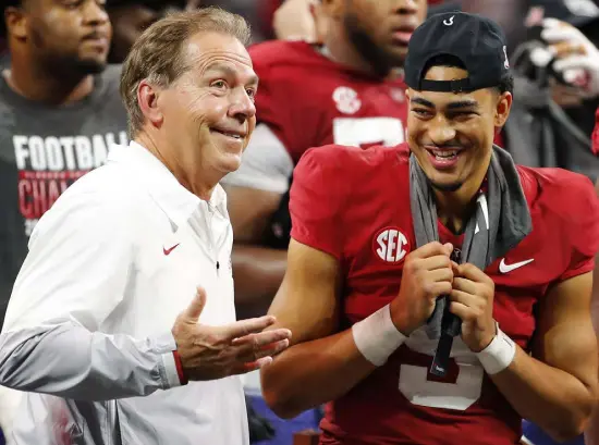  ?? Todd Kirkland, Getty Images ?? Head coach Nick Saban and quarterbac­k Bryce Young celebrate Alabama’s win against the Georgia Bulldogs after the SEC Championsh­ip game at Mercedes-benz Stadium on Saturday in Atlanta.