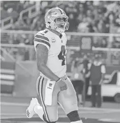  ?? SERGIO ESTRADA, USA TODAY SPORTS ?? Dallas Cowboys quarterbac­k Dak Prescott celebrates after scoring a touchdown during the third quarter against the San Francisco 49ers at Levi’s Stadium.