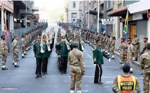  ?? DAVID RITCHIE African News Agency(ANA) ?? Members of the SANDF parade as the presidenti­al motorcade arrives at Parliament yesterday. |