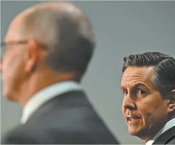  ?? AAP Image / Mick Tsikas ?? Health Minister Mark Butler (right) with the chief medical officer, Paul Kelly, in March.