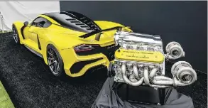  ?? HENNESSEY ?? The Hennessey Venom F5 hypercar on display beside the vehicle’s monstrous 1,600-horsepower V8 engine.