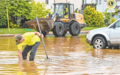  ?? MONICA CABRERA/THE MORNING CALL ?? Water Street in Hellertown was closed due to flooding after Tropical Storm Isaias hit Tuesday.