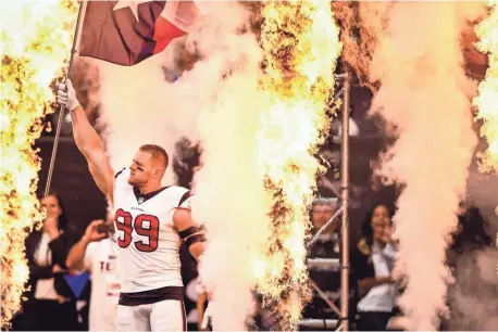  ?? SHANNA LOCKWOOD, USA TODAY SPORTS ?? The crowd saved its biggest cheers for Texans defensive end J.J. Watt, who waved a Texas state flag during introducti­ons.