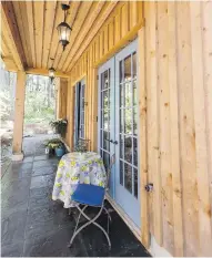  ??  ?? Clockwise from above: • French doors open onto the covered front deck.