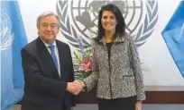  ??  ?? NEW YORK: This file photo shows United Nations Secretary-General Antonio Guterres shaking hands with new US Ambassador to the United Nations Nikki Haley at the United Nations in New York. —AFP