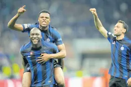  ?? AP ?? Inter Milan’s Romelu Lukaku (bottom left), Denzel Dumfries (top left) and Hakan Calhanoglu celebrate at the end of their Champions League semifinal second-leg football match against AC Milan at the San Siro stadium in Milan, Italy, yesterday.