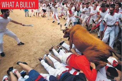  ?? Picture: Reuters ?? A wild cow leaps over revellers in the bull ring following the fourth Running of the Bulls at the San Fermin festival in Pamplona, Spain, yesterday.
