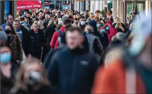  ??  ?? FESTIVE RUSH: Shoppers packed Edinburgh’s Princes Street yesterday afternoon