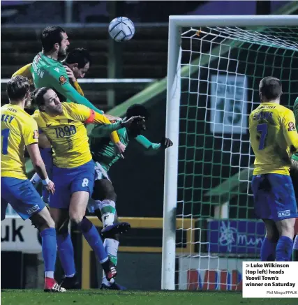  ?? Phil Mingo/PPAUK ?? > Luke Wilkinson (top left) heads Yeovil Town’s winner on Saturday