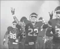  ?? STEPHEN DUNN | ASSOCIATED PRESS ?? UCONN linebacker Eli Thomas raises his arms to the crowd as the Huskies enter the field for their opening game against Central Florida on Aug. 30. Thomas suffered a stroke on campus on Oct. 10.