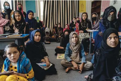  ?? The Associated Press ?? ■ Afghan girls attend a class on July 28 at an undergroun­d school in Kabul, Afghanista­n. For most teenage girls in Afghanista­n, it’s been a year since they set foot in a classroom. With no sign the ruling Taliban will allow them back to school, some girls and parents are trying to find ways to keep education from stalling for a generation of young women.