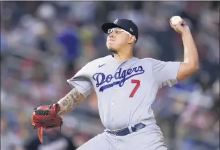  ?? JULIO CORTEZ — THE ASSOCIATED PRESS ?? Julio Urias, the Dodgers’ starter Friday night, has become all the more valuable with the rotation shorthande­d.