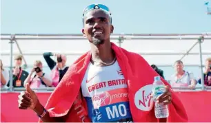  ?? AFP ?? Mo Farah poses after completing the men’s race in the 2014 London Marathon. —