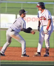  ?? Jeremy Stewart / Rome News-Tribune ?? Rome’s Lucas Herbert (right) stops in his tracks just before Charleston shortstop Hoy Jun Park tags him out to end the fourth inning Tuesday at State Mutual Stadium.