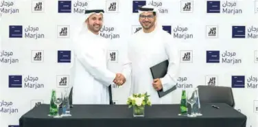  ?? ?? ↑
Officials of Aldar and Marjan after signing the agreement.