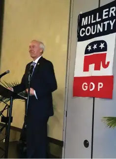  ?? Staff photo by Karl Richter ?? ■ Arkansas Gov. Asa Hutchinson speaks Monday during the Miller County Republican Committee’s Red White and Blue Lincoln Day Dinner at the Arkansas Convention Center in Texarkana, Ark.