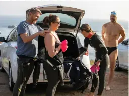  ??  ?? LEFT Pre-swim kink removal after a hectic doctor’s consult while driving over Buitengrac­ht Street to make the swim on time.
RIGHT There are numerous health benefits of swimming in the wild, cold waters. And that’s what they’ll keep telling themselves.