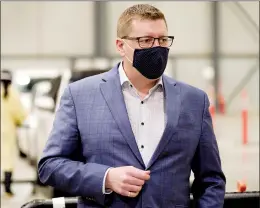  ?? CP FILE PHOTO ?? Saskatchew­an Premier Scott Moe tours the COVID-19 mass immunizati­on clinic and drive-thru immunizati­on space at Internatio­nal Trade Centre in Regina on Feb. 18.